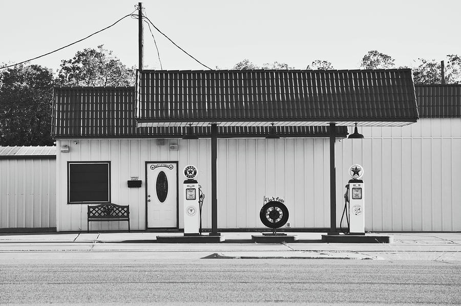 Old Gas Station and Pumps in Black and White Photograph by Gaby Ethington