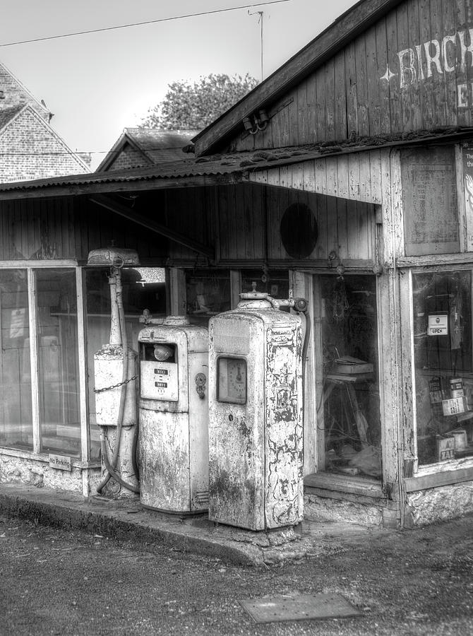 Old gas station in black and white Photograph by B Cash