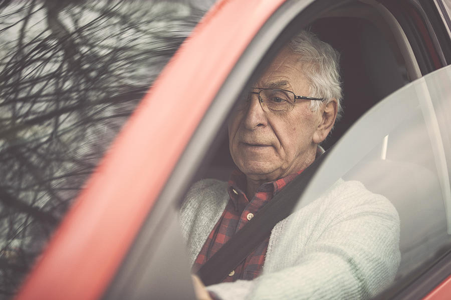 Old gentleman drives car Photograph by Rike_