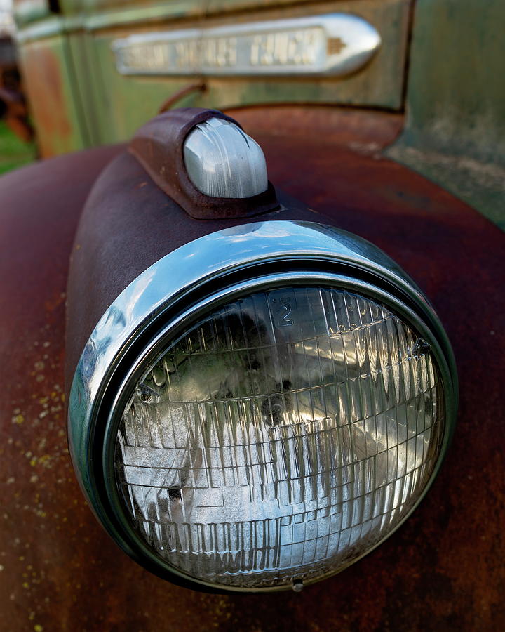 Old GMC truck - headlights and fender Photograph by Art Whitton