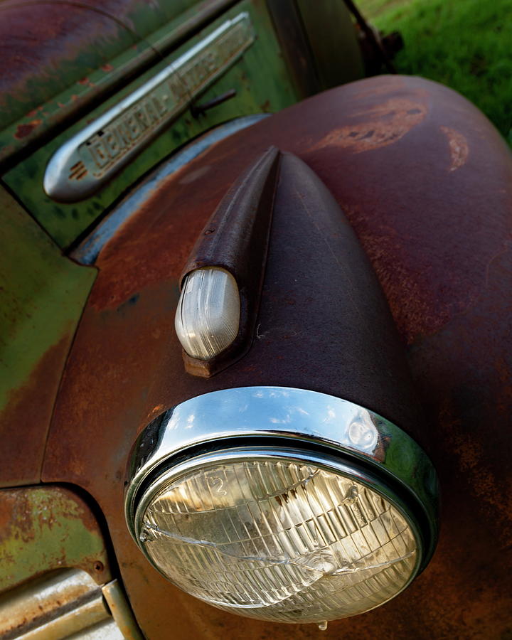 Old GMC Truck Light and Fender Photograph by Art Whitton