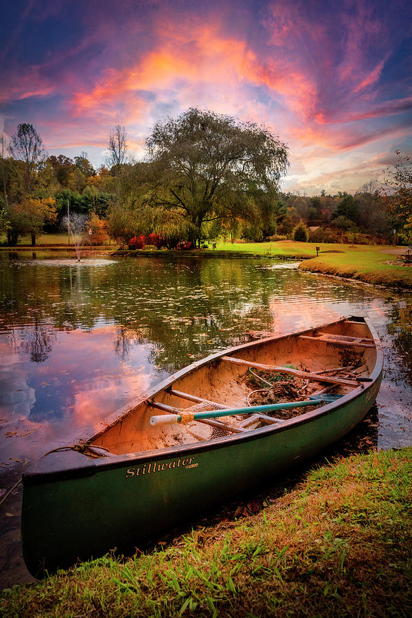 Old Green Canoe under Sunset Skies Photograph by Debra and Dave Vanderlaan