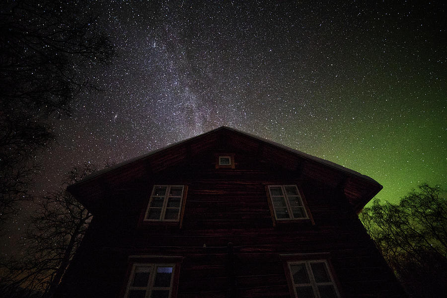 Old House under a Sky with Stars and Northern Lights Photograph by Pekka Sammallahti