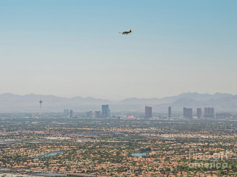 Las Vegas Photograph - Old jet fighter fly over the famous Strip by Chon Kit Leong