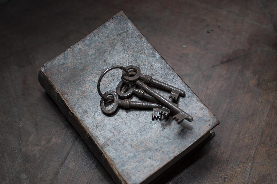 Old keys on top of an old book Photograph by Rui Almeida Fotografia