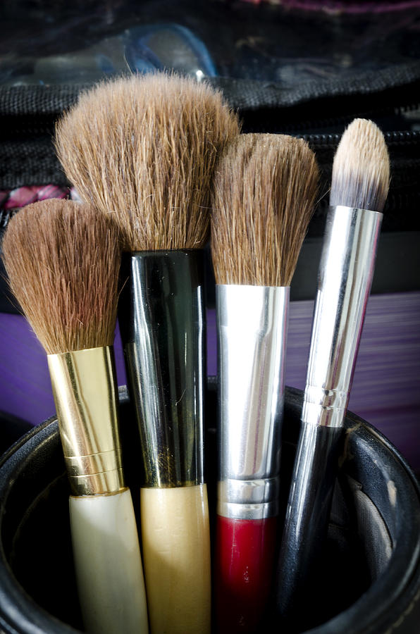 Old makeup brushes in holder Photograph by Sirikornt