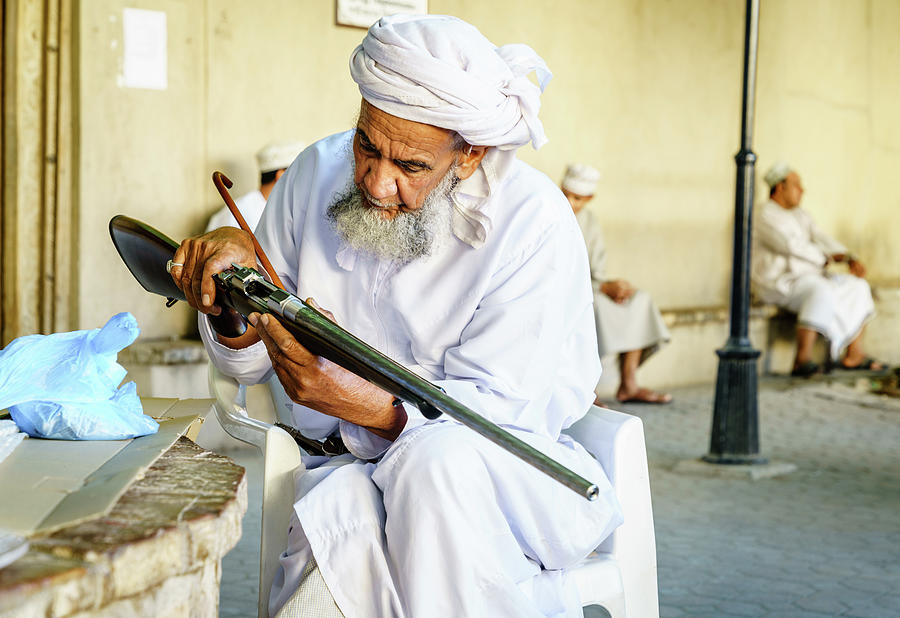 Old man and a gun Photograph by Alexey Stiop
