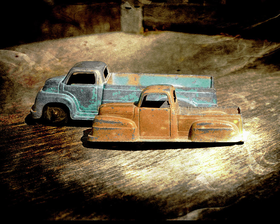 Old Metal Toy Trucks textured photograph Photograph by Ann Powell