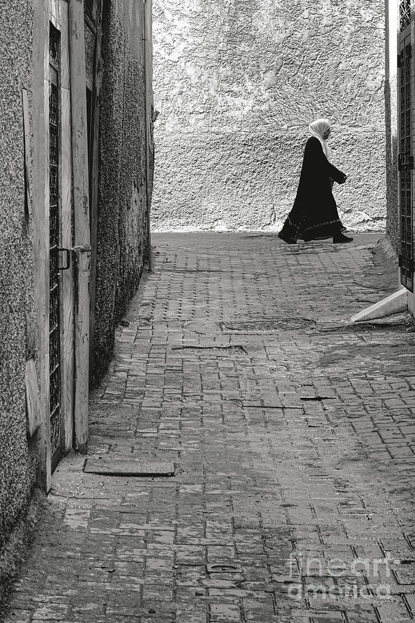 Old Moroccan Woman Walking in a Street Photograph by Olivier Le Queinec