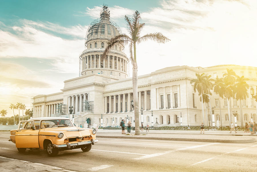 old orange american car in front of Capitol in Havanna Photograph by Golero