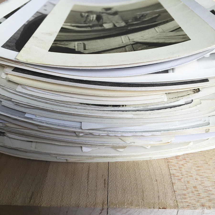 Old Photographs in a Stack on WOod Photograph by Bgwalker