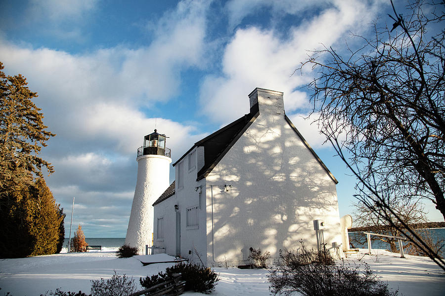 Old Presque Isle Lighthouse in Michigan along Lake Huron in the winter Photograph by Eldon McGraw