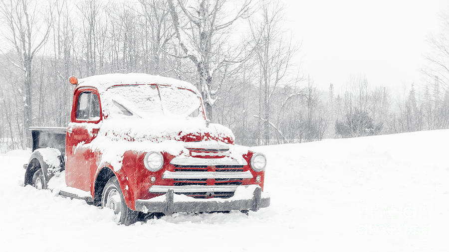 Old Red American Pickup Truck in a Snowstorm Photograph by Edward Fielding