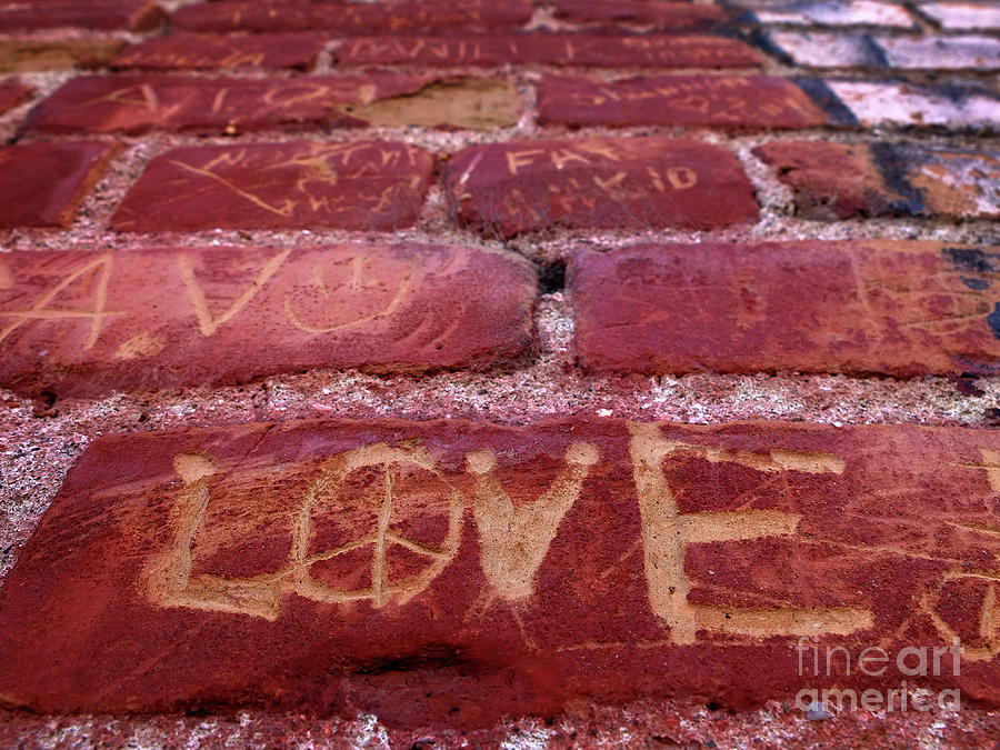 Old Red Brick Wall with Words Names and Love Scratched or Carved Photograph by Lane Erickson