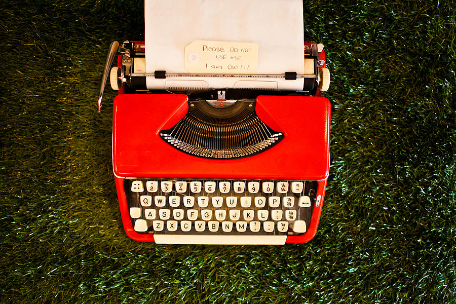 Old red typewriter Photograph by Jarod Rawsthorne