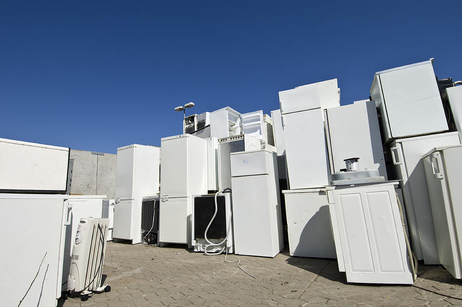 Old Refrigerators Waiting to Be  Scrapped At a Recycling Center Photograph by ClarkandCompany