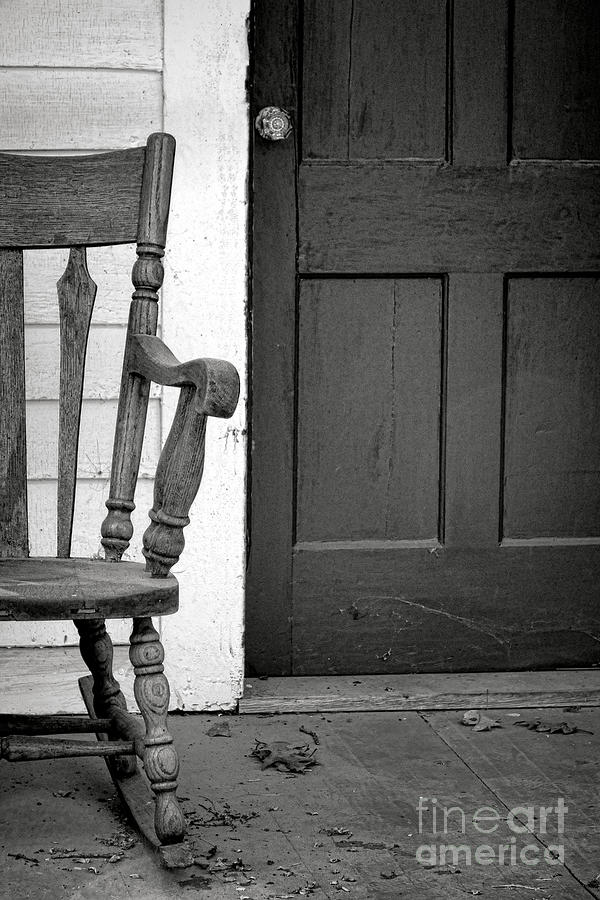 Old Rocking Chair on a Porch Photograph by Olivier Le Queinec
