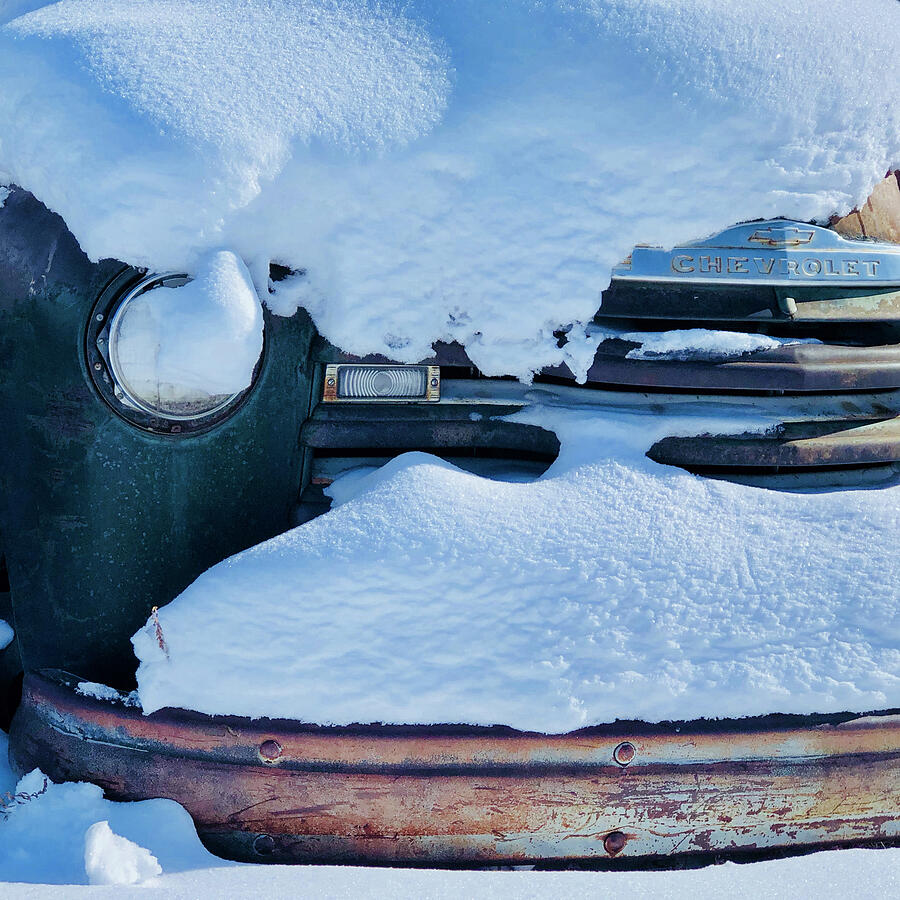 Old rusty Chevrolet covered by snow in Montana Digital Art by Tatiana Travelways