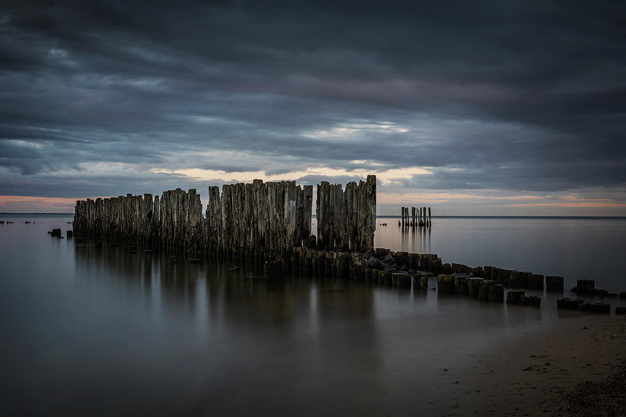 Old Sea Pier Remains At Grim Dusk Photograph by Artur Bogacki