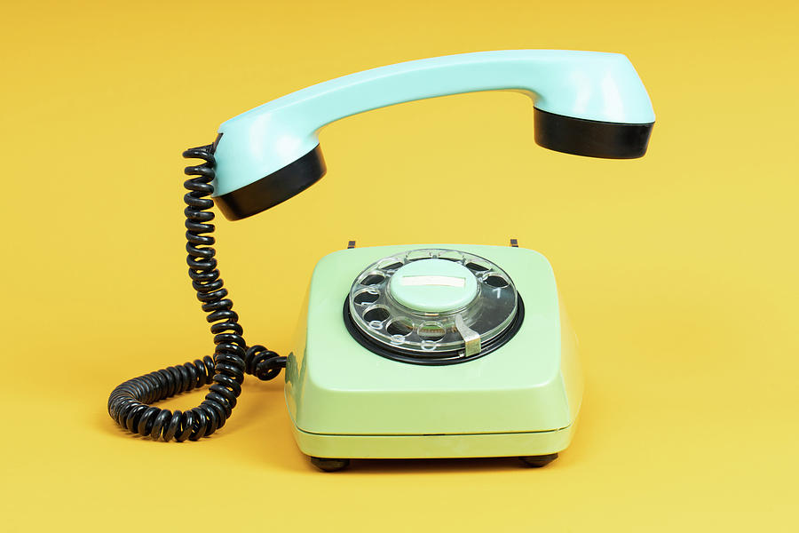 https://images.fineartamerica.com/images/artworkimages/mediumlarge/3/old-telephone-on-yellow-background-vintage-phone-with-taken-off-receiver-michael-dechev.jpg