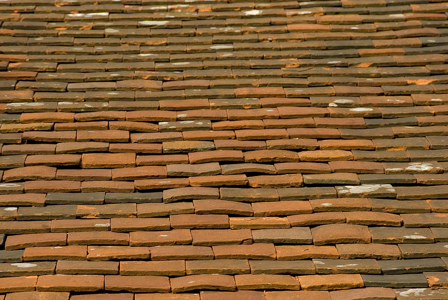 Old terracotta tiles on roof Photograph by Lyn Holly Coorg