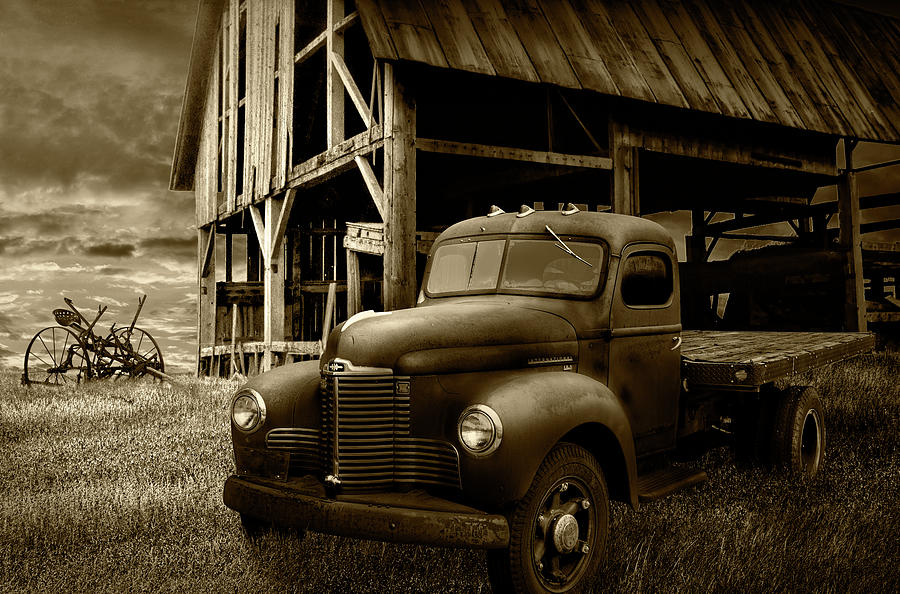 Old Truck Relic with Barn Skeleton in Sepia Tone Photograph by Randall Nyhof
