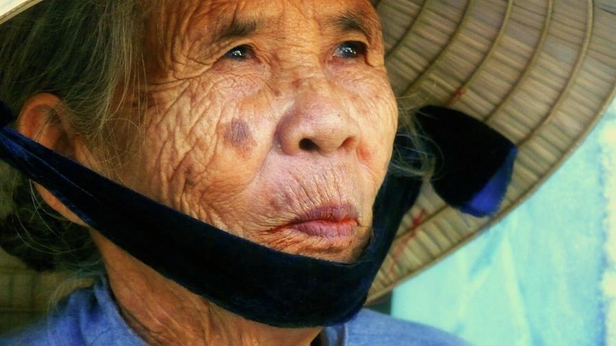 Old Vietnamese lady with the conical hat Photograph by Robert Bociaga