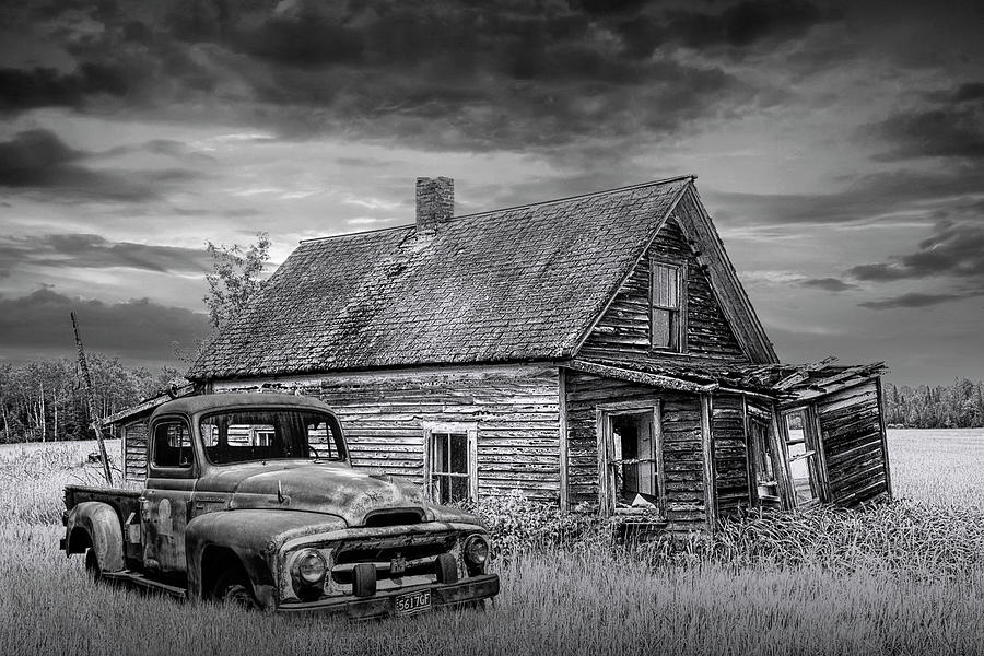 Old Vintage Pickup Truck by an Abandoned House at Sunset in Blac Photograph by Randall Nyhof