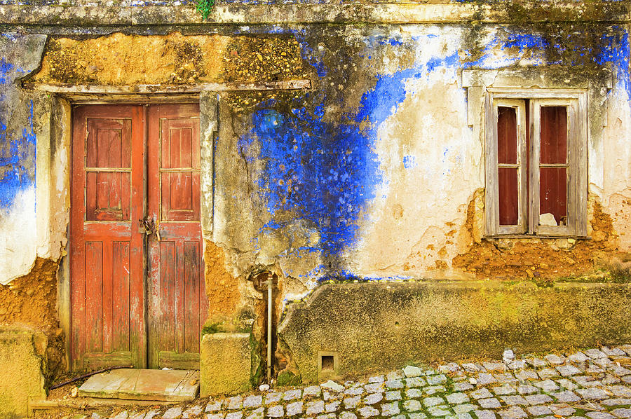 Old walls and door of a ruined blue painted cottage in the village of Alzejur, Algarve, Portugal Photograph by Neale And Judith Clark
