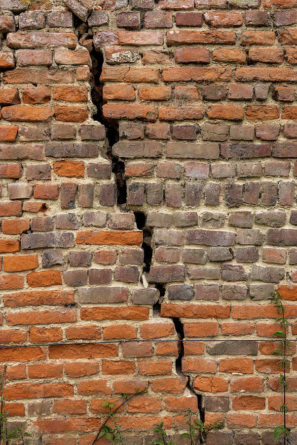 Old worn out brick wall background with large crack Photograph by ...