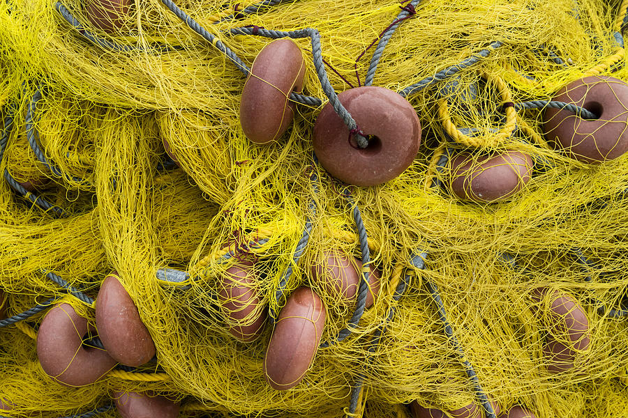 Old yellow fishing nets Photograph by PicturePartners
