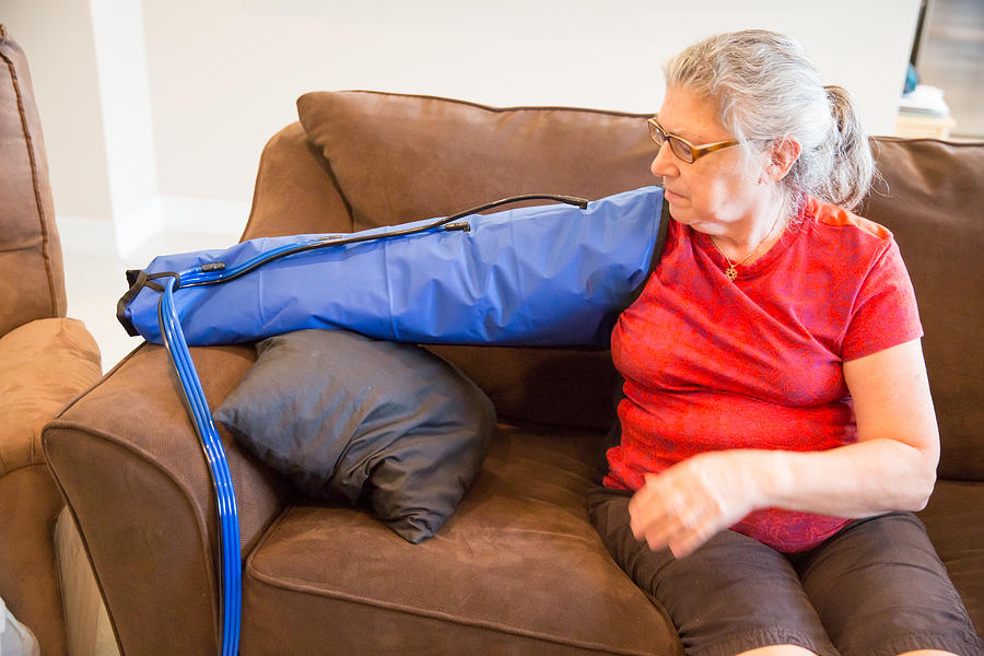 Older woman being treated with lymphedema therapy Photograph by JodiJacobson