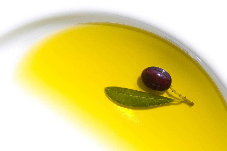 Olive in oil Photograph by Seraficus