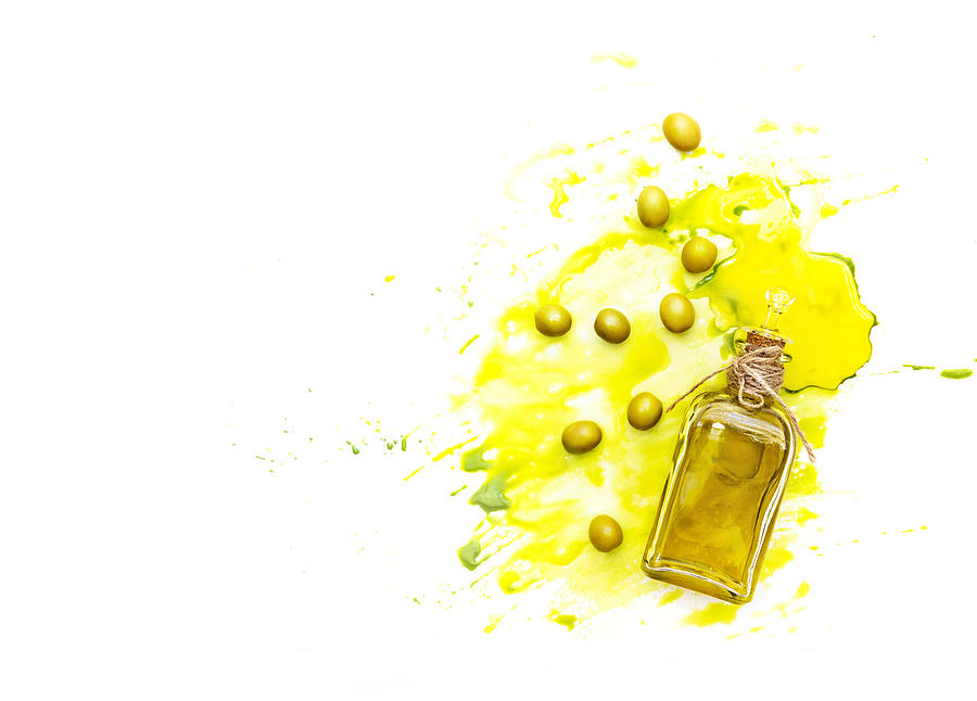 Olive oil and green olives shot from above. Creative food shot with watercolor. Photograph by Victoria Bee Photography