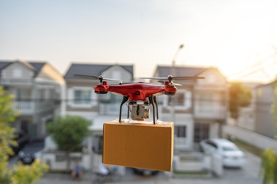 On 23 February 2020, Bangkok, Thailand Delivery drone carrying urgent shipment box in a city. Photograph by Witthaya Prasongsin