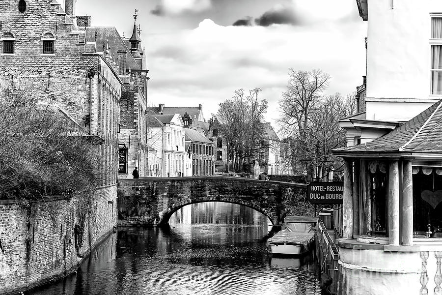 On the Canal Bridge in Bruges Photograph by John Rizzuto
