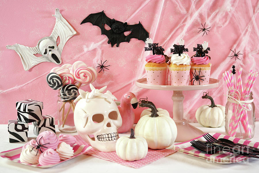 On trend pink Halloween party table with cupcakes Photograph by Milleflore Images