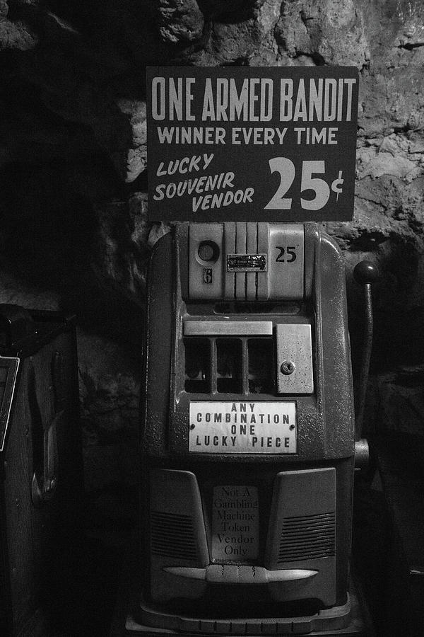 One Armed Bandit machine on Historic Route 66 at Meramec Caves in Missouri in BW Photograph by Eldon McGraw