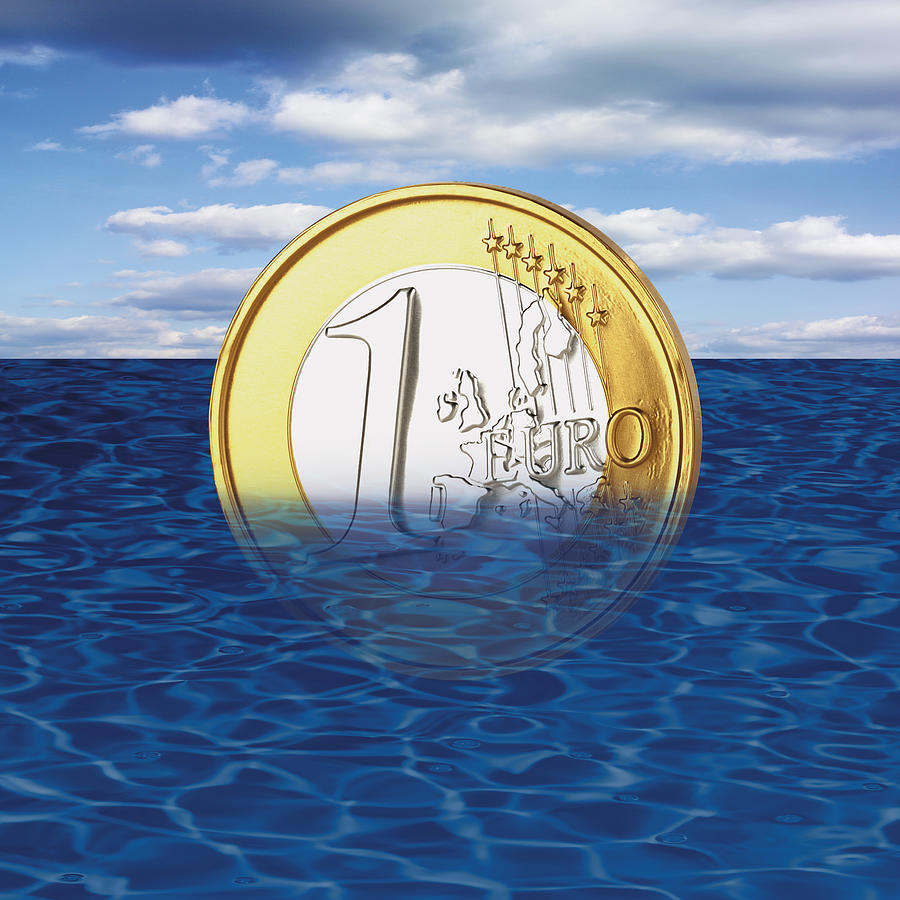 One euro coin drowning in sea, close-up Photograph by Tuned_In