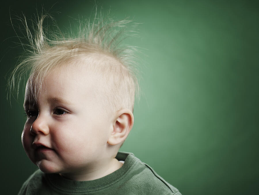 One year old boy with hair sticking up.  Photograph by Ryan McVay