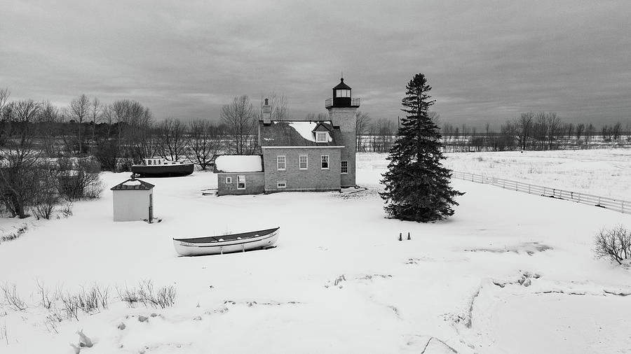 Ontonagon Michigan Lighthouse along Lake Superior in winter in black and white Photograph by Eldon McGraw