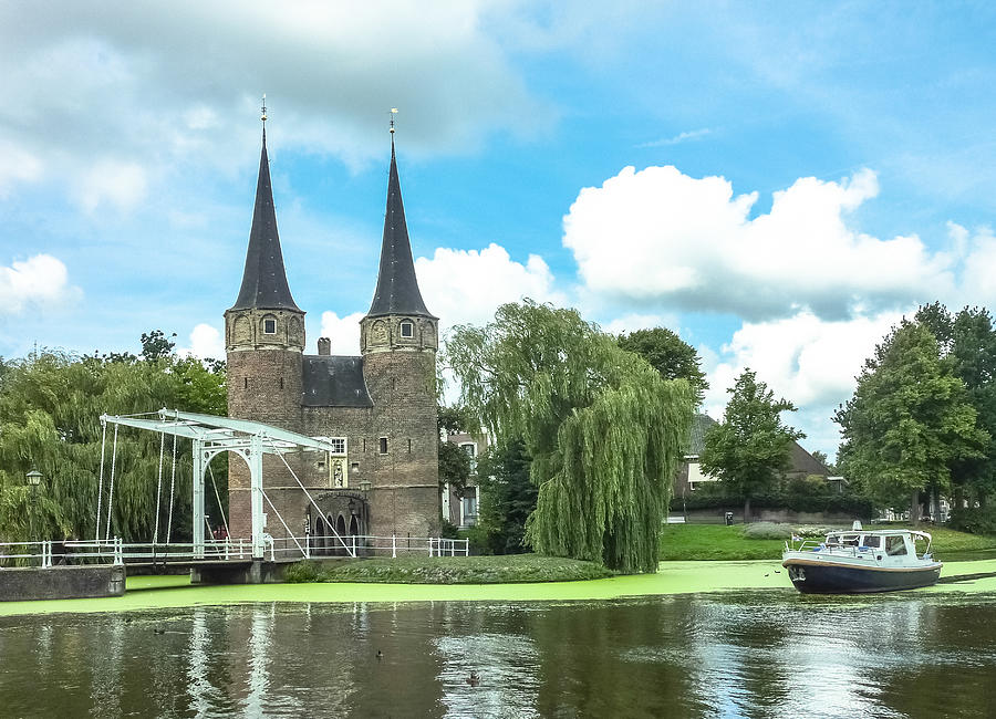 Oostpoort (Eastern Gate), a medieval dam gate with typical small white drawbridge in Delft, the Netherlands Photograph by Smartshots International