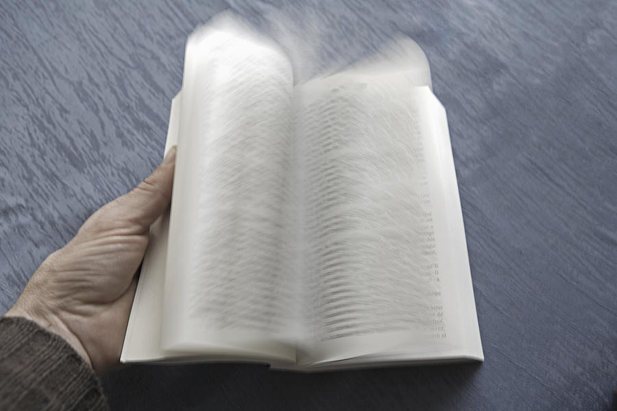 Open book with pages turning, blurred motion Photograph by Bertrand Demee