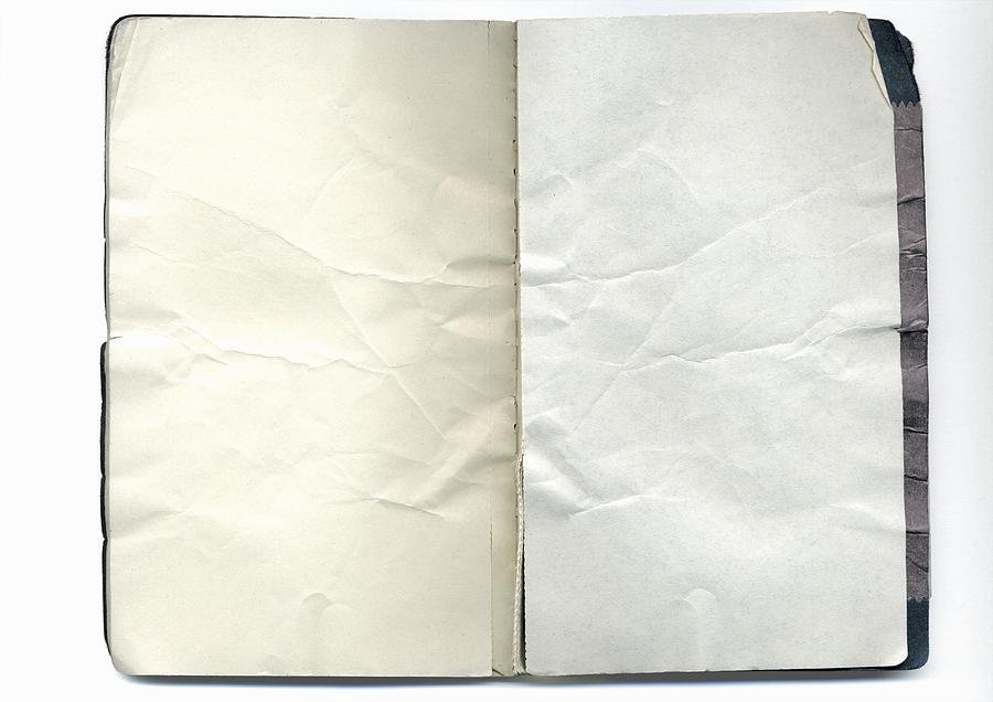 Open notebook with crumpled pages Photograph by Martin Hospach