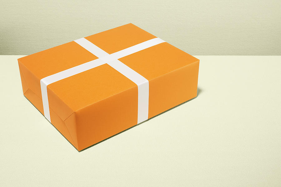 Orange and white gift Photograph by Microzoa Limited