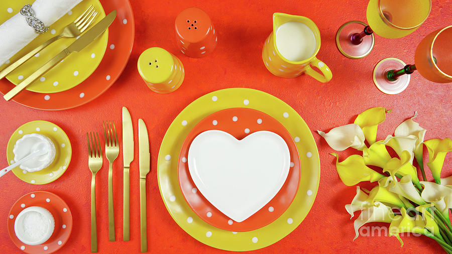 Orange and yellow aesthetic modern events table place setting top view flat lay. Photograph by Milleflore Images