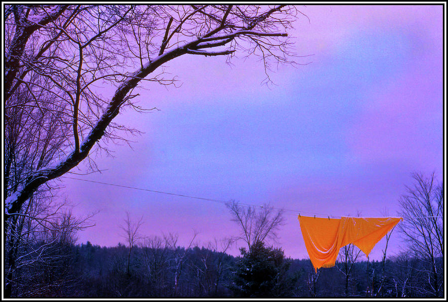Orange Bedspread on a Winter Line Photograph by Wayne King