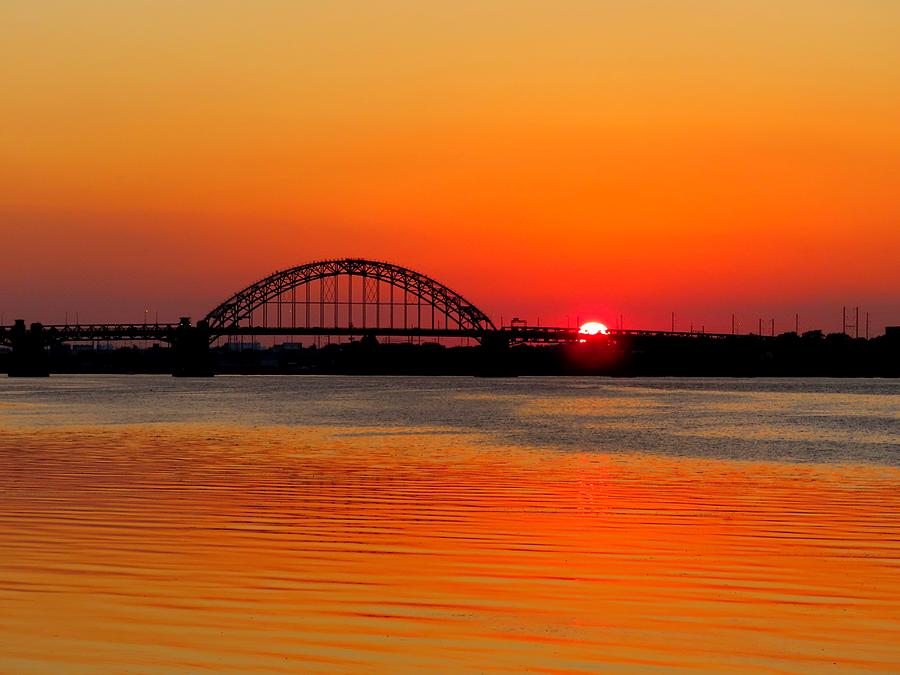 Orange Blaze as Sun Sets on the Delaware River Photograph by Linda Stern