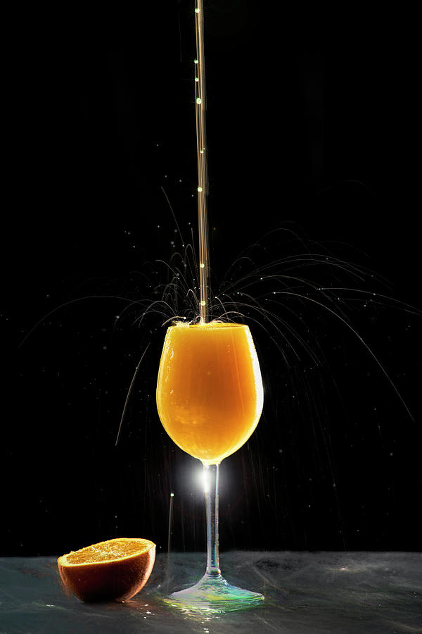 Orange juice explosion Photograph by Dan Friend