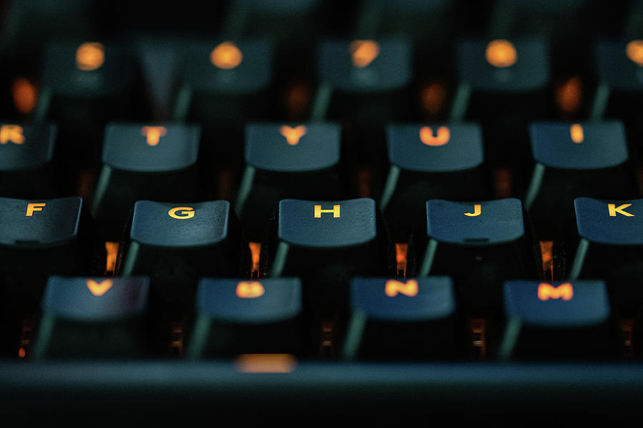 Orange Lettered Keys On A Black Keyboard Photograph by Scott Lyons